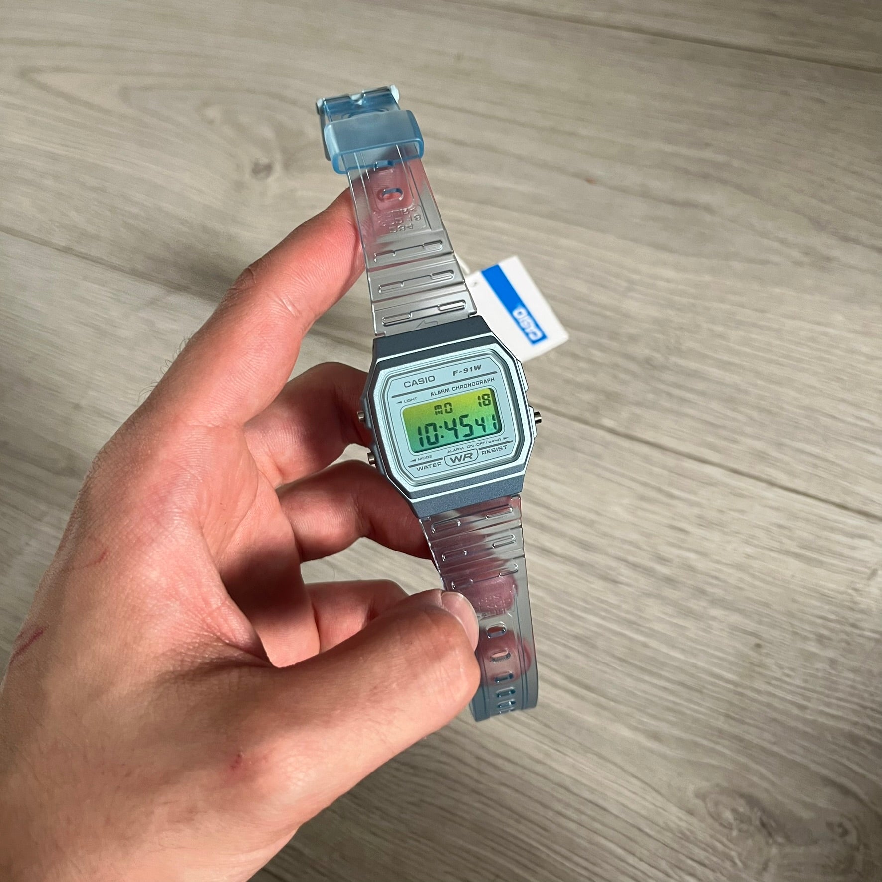 Custom Casio F-91W Blue digital watch featuring a Gradient Blue and green filter screen. Slim 8.5 mm profile, lightweight 21 g build and flexible bio-based resin band ensure lasting comfort. Includes alarm, stopwatch, and microlight function for everyday functionality.