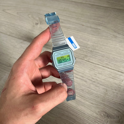 Custom Casio F-91W Blue digital watch featuring a Gradient Blue and green filter screen. Slim 8.5 mm profile, lightweight 21 g build and flexible bio-based resin band ensure lasting comfort. Includes alarm, stopwatch, and microlight function for everyday functionality.
