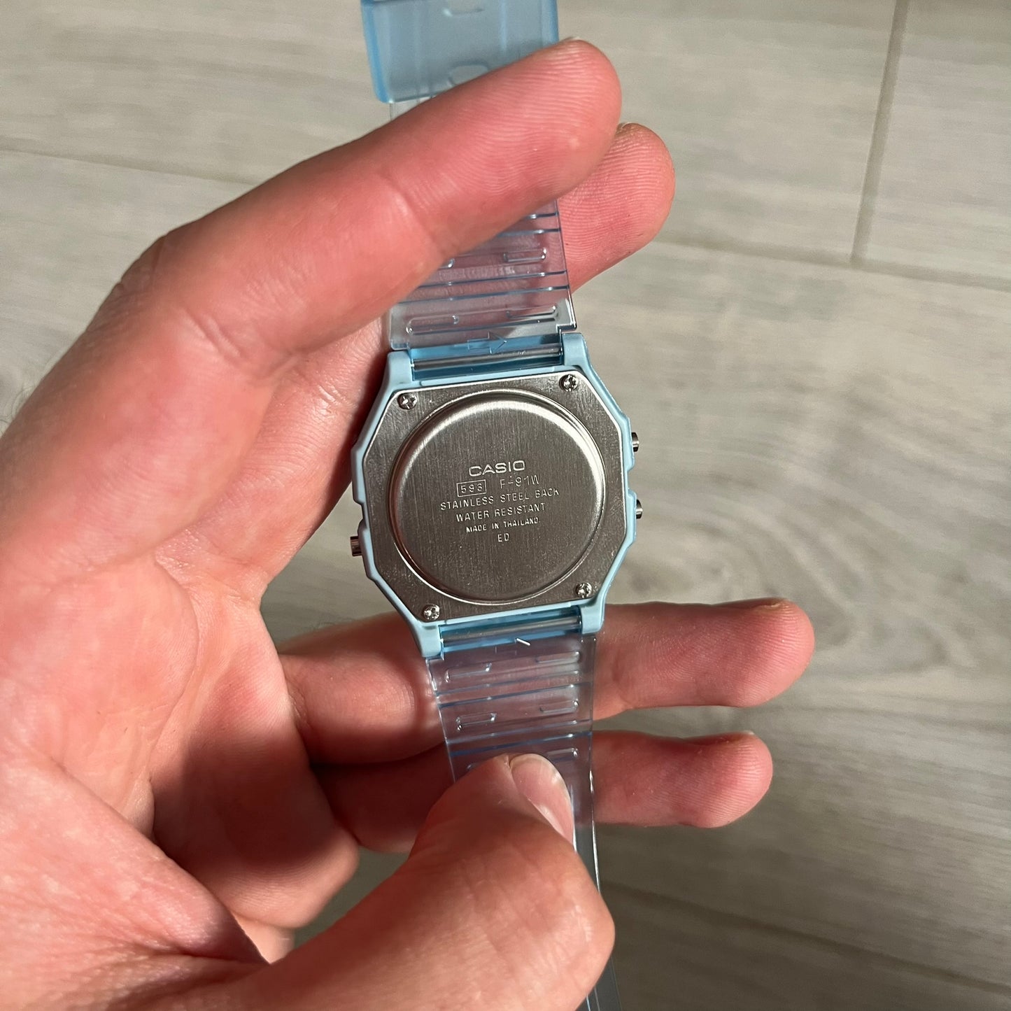 Custom Casio F-91W Blue digital watch featuring a Gradient Blue and green filter screen. Slim 8.5 mm profile, lightweight 21 g build and flexible bio-based resin band ensure lasting comfort. Includes alarm, stopwatch, and microlight function for everyday functionality.