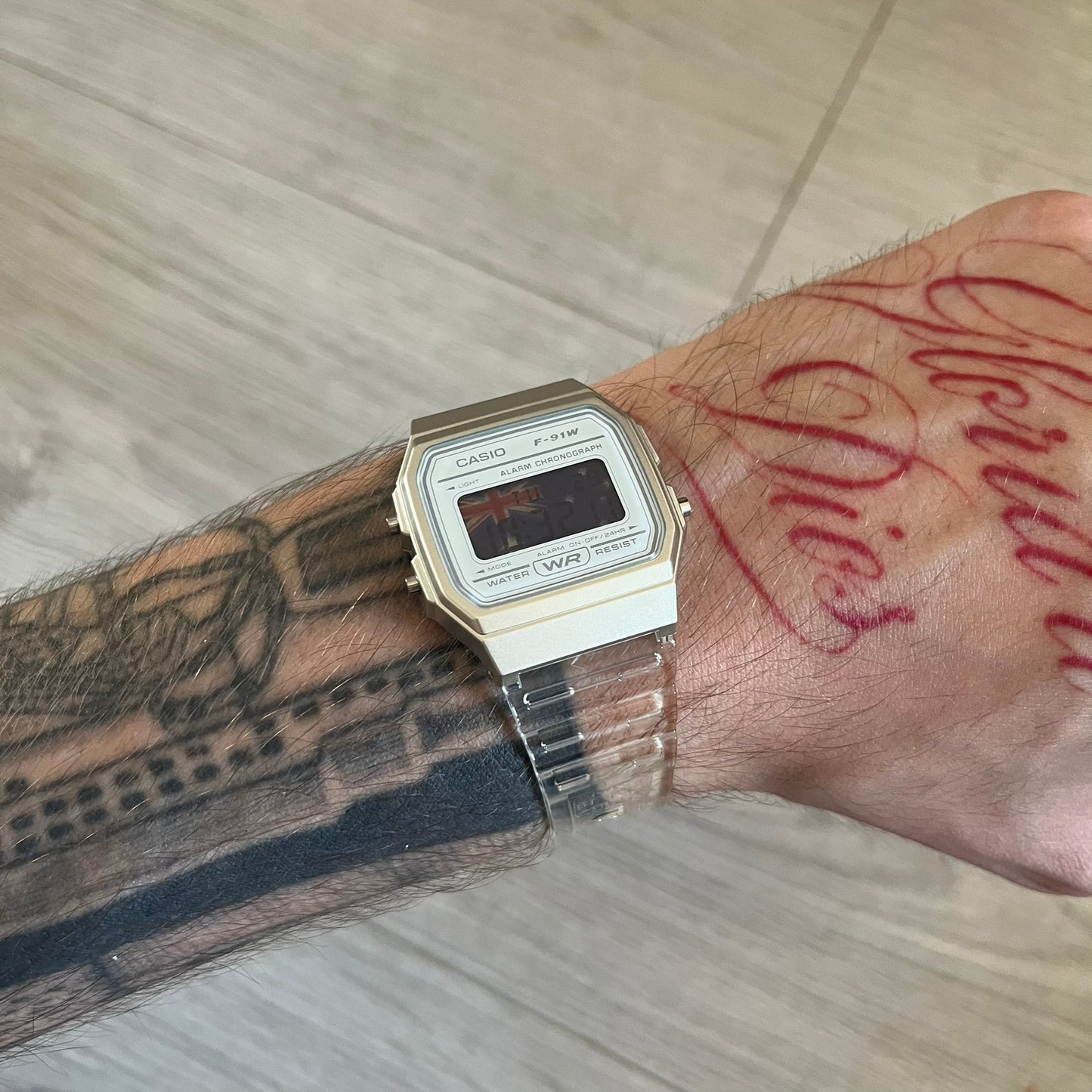 Custom Casio F-91W Clear/Transparent digital watch featuring a Australia Flag filter screen. Slim 8.5 mm profile, lightweight 21 g build and flexible bio-based resin band ensure lasting comfort. Includes alarm, stopwatch, and microlight function for everyday functionality.