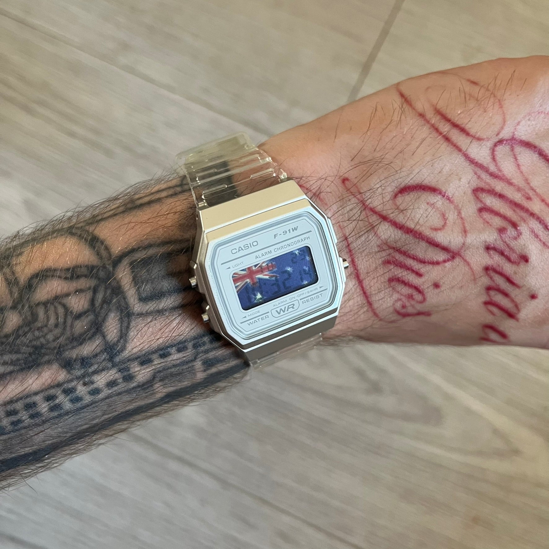 Custom Casio F-91W Clear/Transparent digital watch featuring a Australia Flag filter screen. Slim 8.5 mm profile, lightweight 21 g build and flexible bio-based resin band ensure lasting comfort. Includes alarm, stopwatch, and microlight function for everyday functionality.