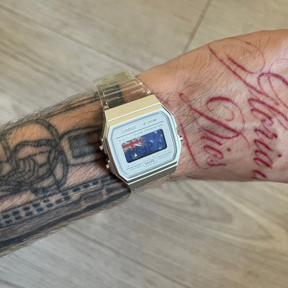 Custom Casio F-91W Clear/Transparent digital watch featuring a Australia Flag filter screen. Slim 8.5 mm profile, lightweight 21 g build and flexible bio-based resin band ensure lasting comfort. Includes alarm, stopwatch, and microlight function for everyday functionality.