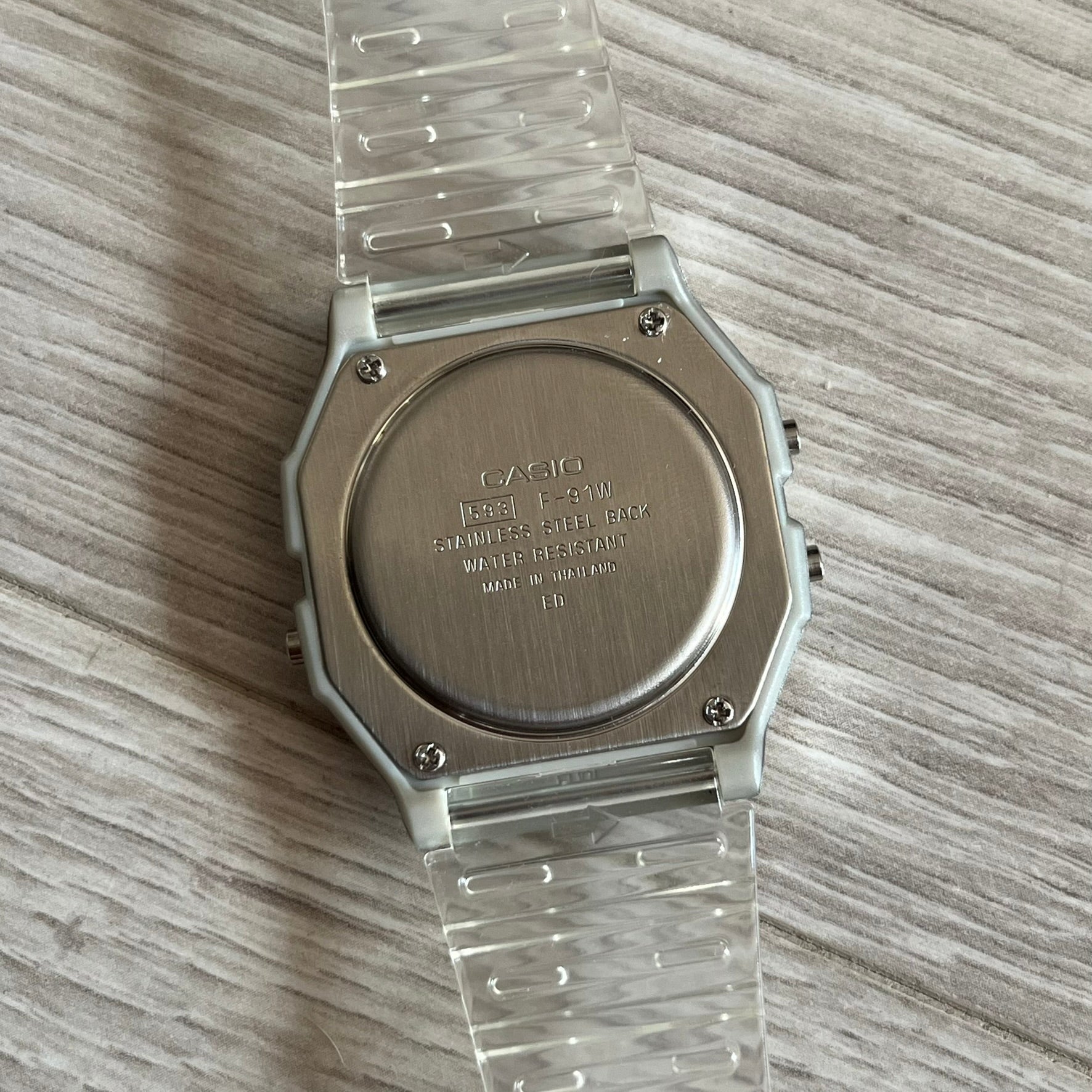 Custom Casio F-91W Clear/Transparent digital watch featuring a Awesome Face filter screen. Slim 8.5 mm profile, lightweight 21 g build and flexible bio-based resin band ensure lasting comfort. Includes alarm, stopwatch, and microlight function for everyday functionality.