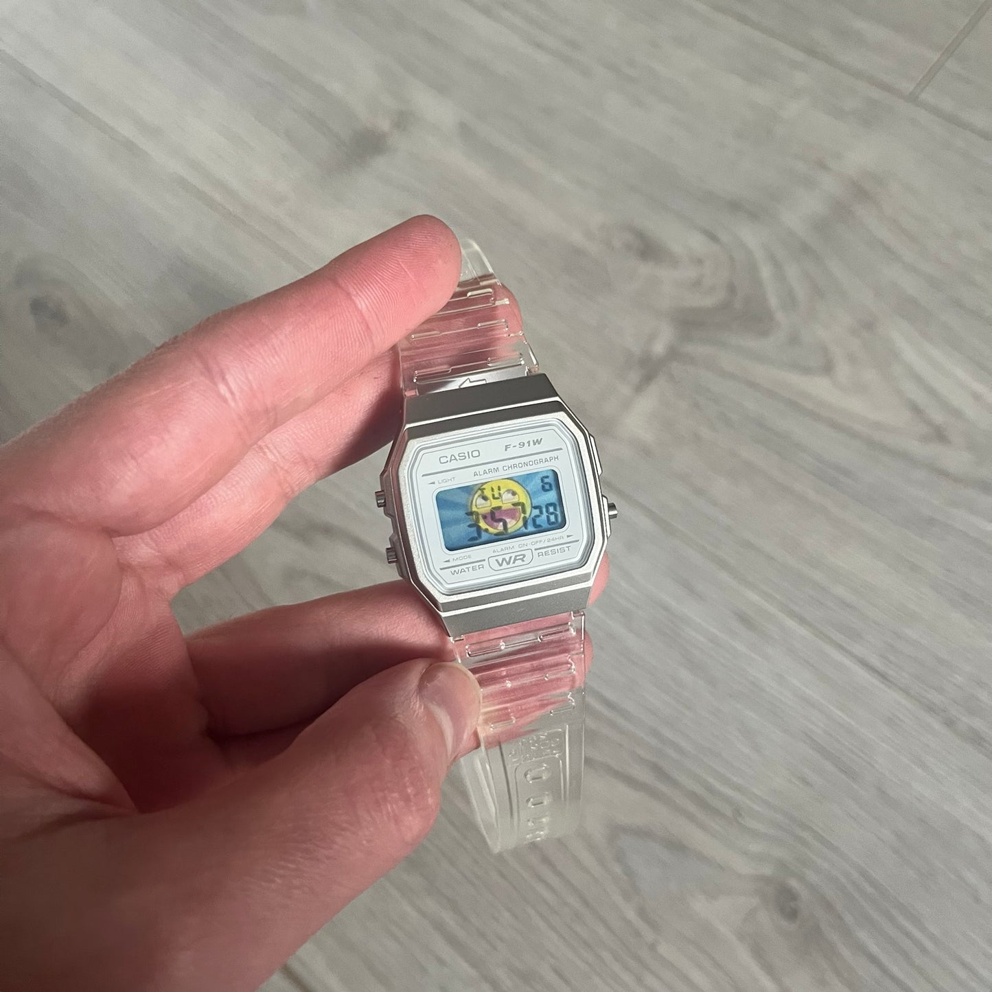 Custom Casio F-91W Clear/Transparent digital watch featuring a Awesome Face filter screen. Slim 8.5 mm profile, lightweight 21 g build and flexible bio-based resin band ensure lasting comfort. Includes alarm, stopwatch, and microlight function for everyday functionality.