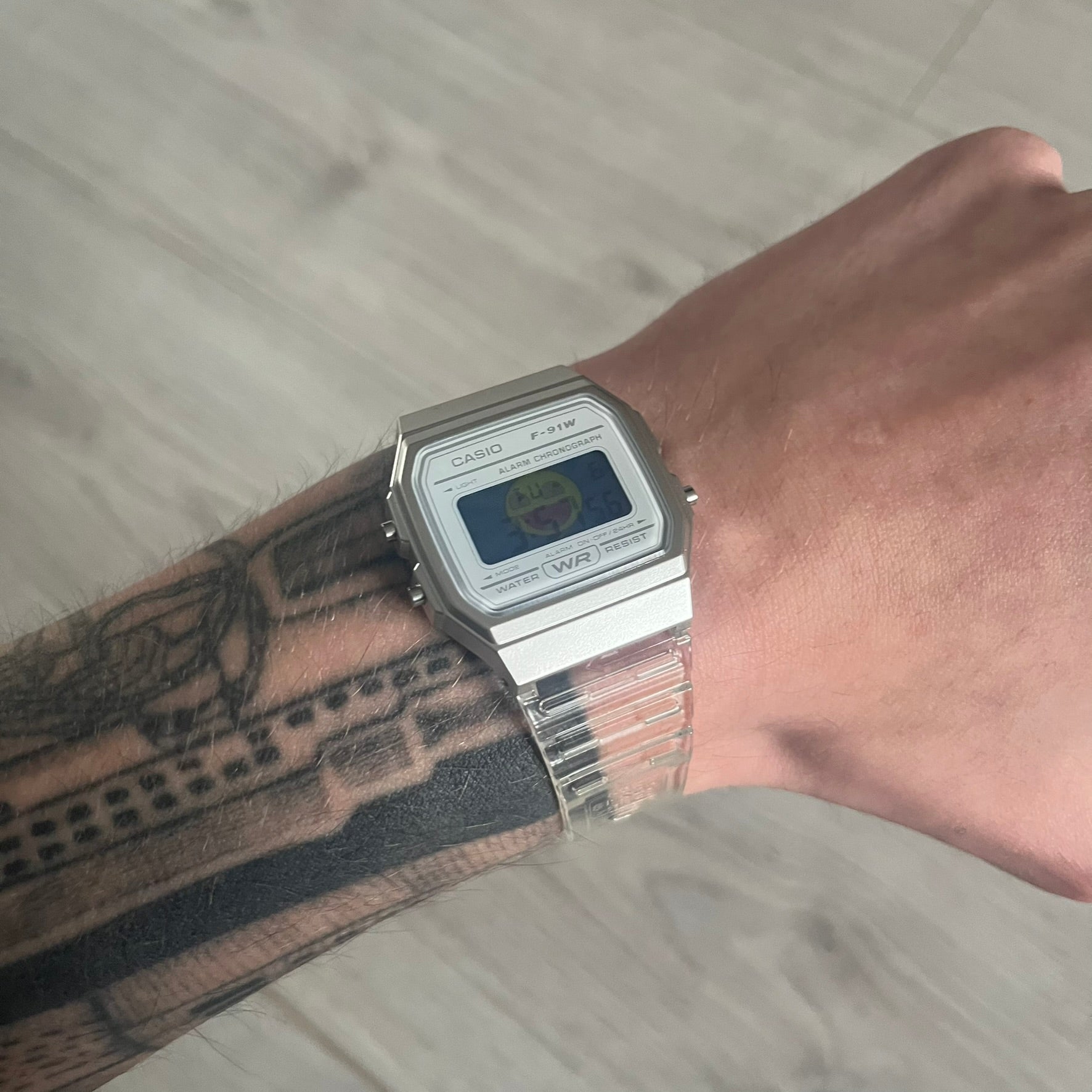 Custom Casio F-91W Clear/Transparent digital watch featuring a Awesome Face filter screen. Slim 8.5 mm profile, lightweight 21 g build and flexible bio-based resin band ensure lasting comfort. Includes alarm, stopwatch, and microlight function for everyday functionality.