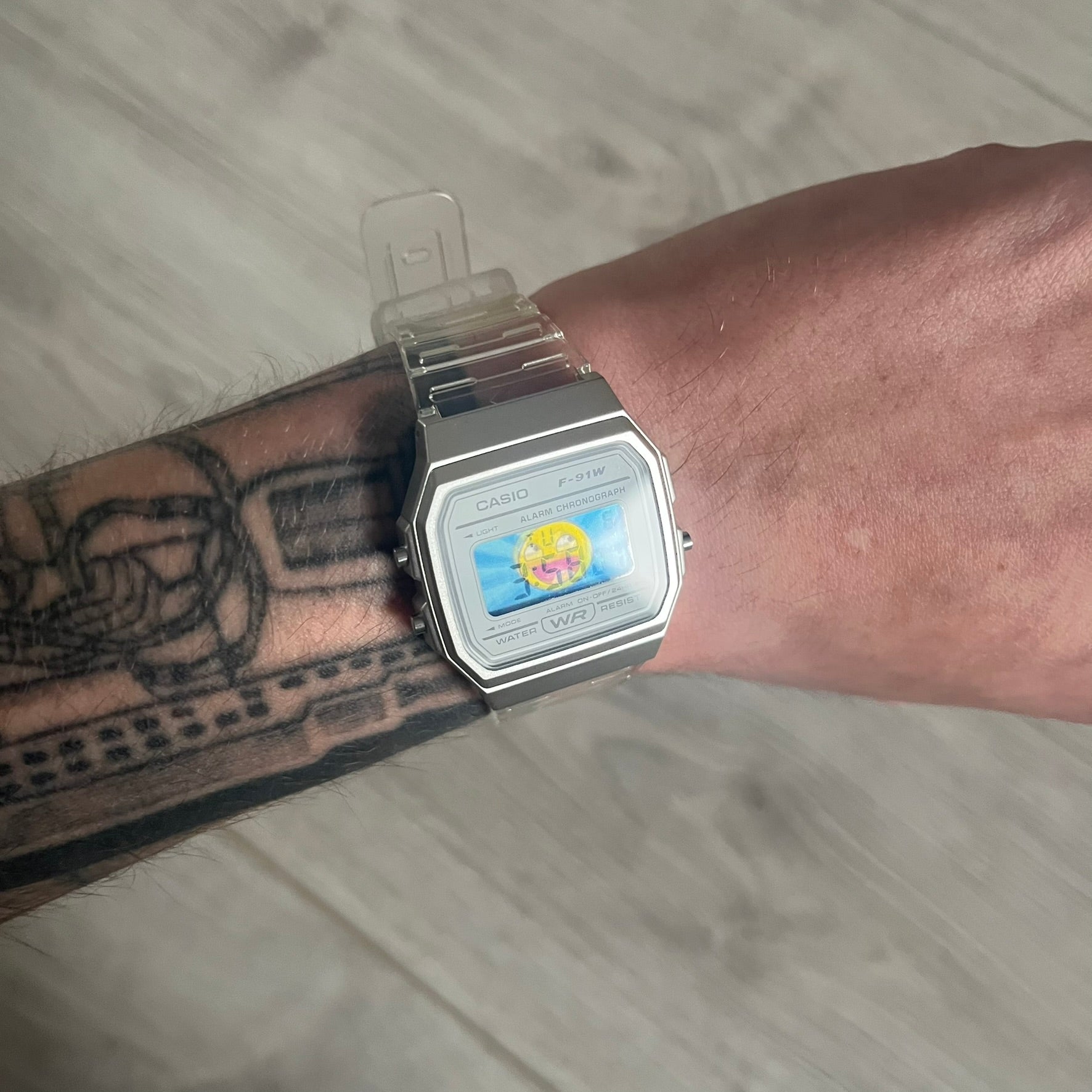 Custom Casio F-91W Clear/Transparent digital watch featuring a Awesome Face filter screen. Slim 8.5 mm profile, lightweight 21 g build and flexible bio-based resin band ensure lasting comfort. Includes alarm, stopwatch, and microlight function for everyday functionality.