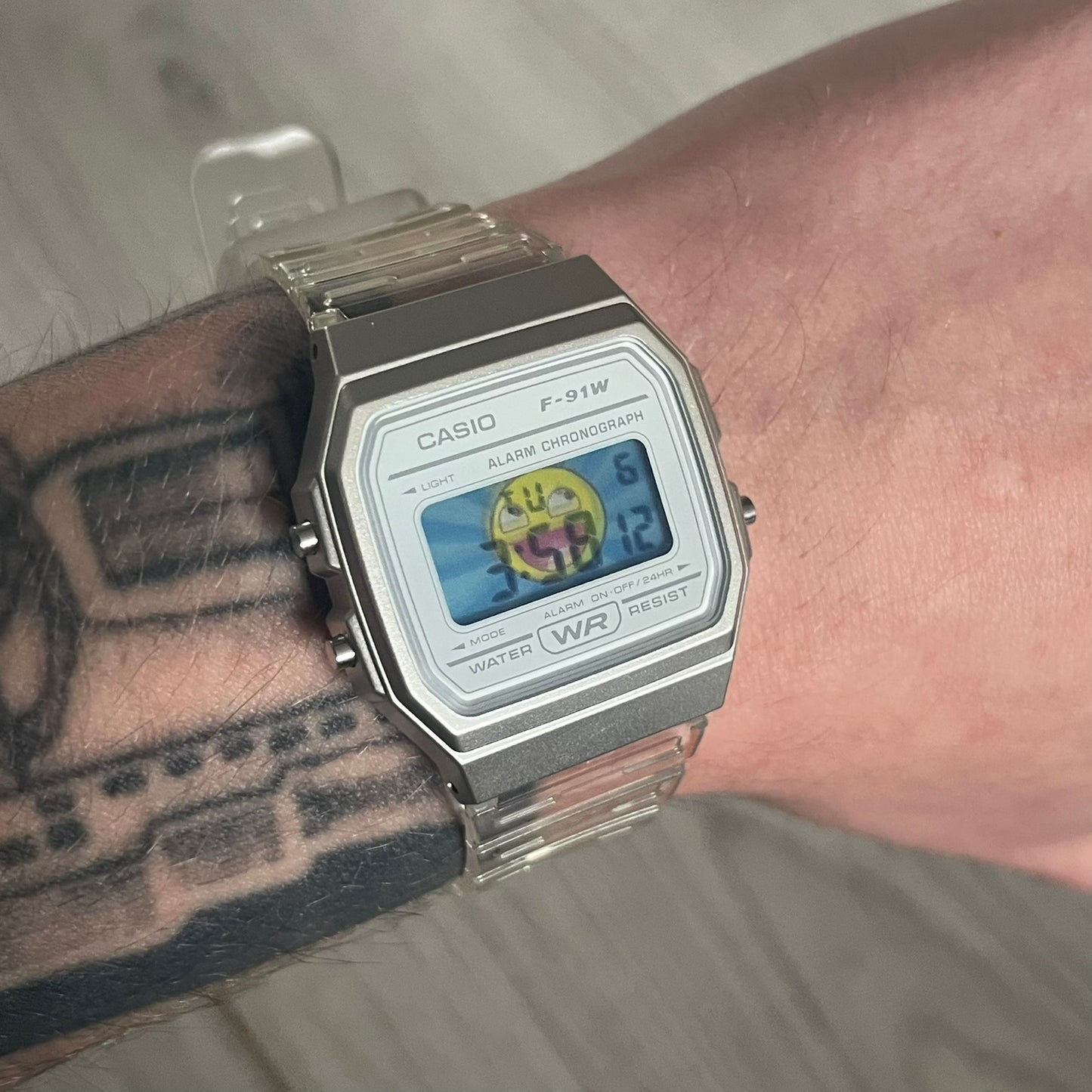 Custom Casio F-91W Clear/Transparent digital watch featuring a Awesome Face filter screen. Slim 8.5 mm profile, lightweight 21 g build and flexible bio-based resin band ensure lasting comfort. Includes alarm, stopwatch, and microlight function for everyday functionality.