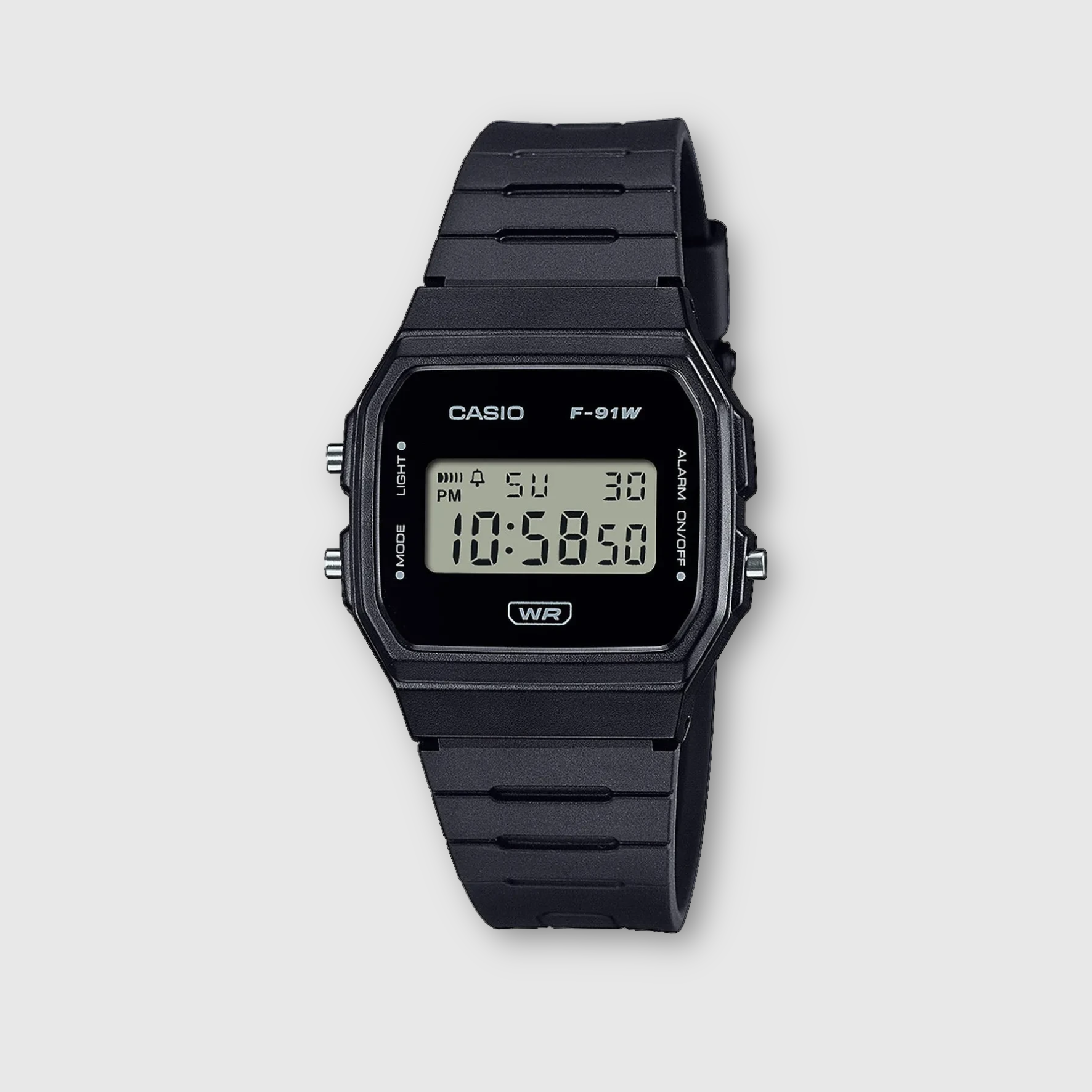 Black Casio digital watch on a light gray background