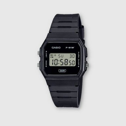 Black Casio digital watch on a light gray background