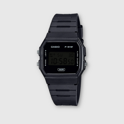 Black Casio digital watch on a light gray background