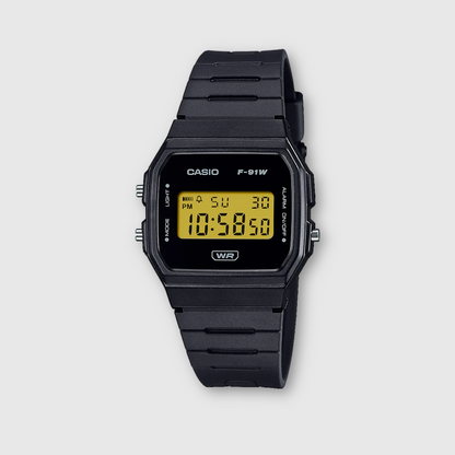 Black Casio digital watch on a light gray background