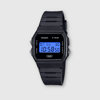 Black Casio digital watch on a light gray background