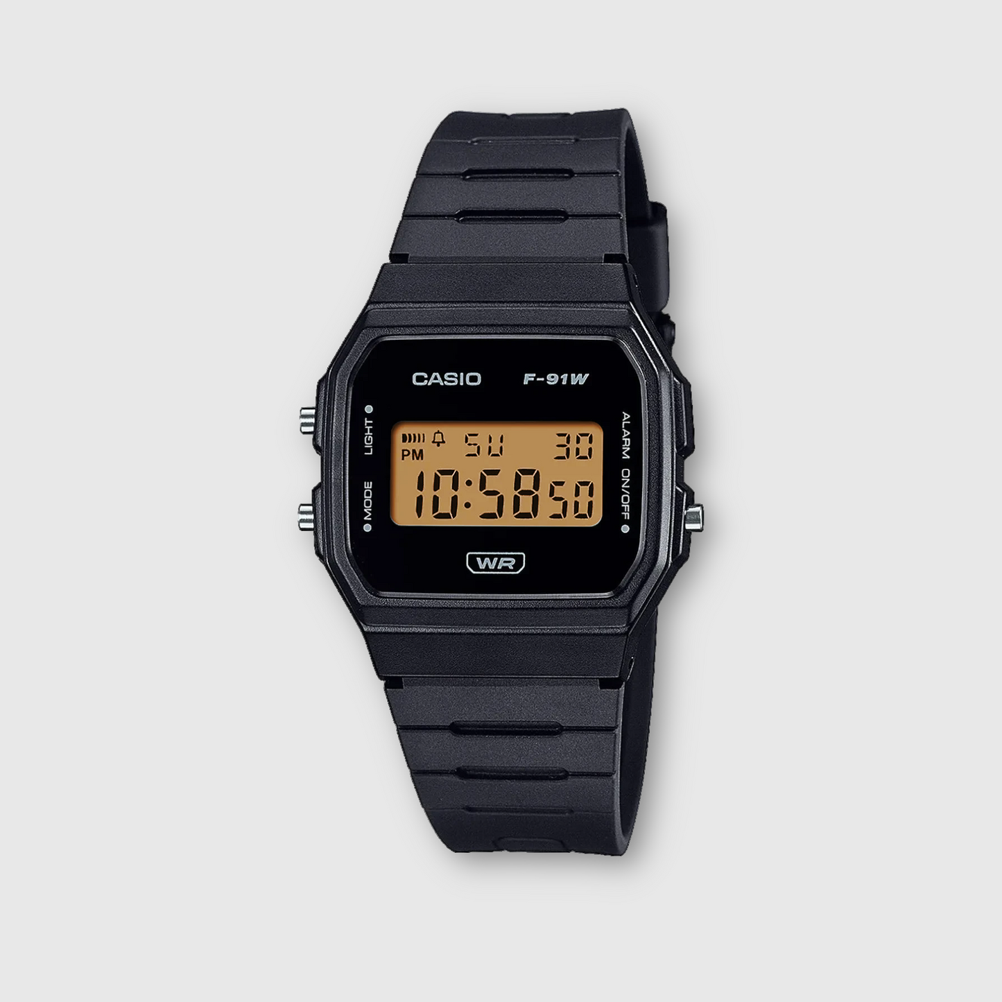 Black Casio digital watch on a light gray background