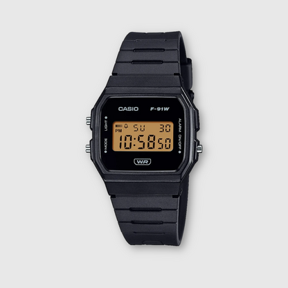 Black Casio digital watch on a light gray background