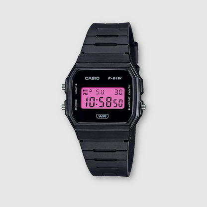 Black Casio digital watch with pink display on a light gray background