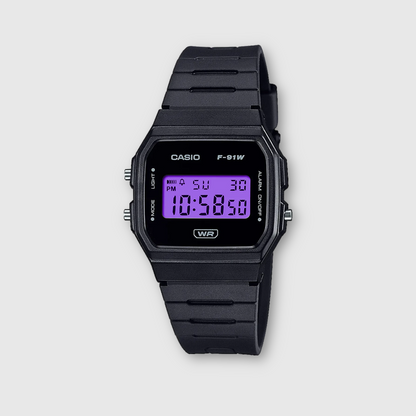 Black Casio digital watch on a light gray background
