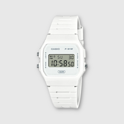 White Casio digital watch on a light gray background