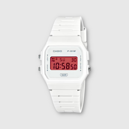 White Casio digital watch on a light gray background