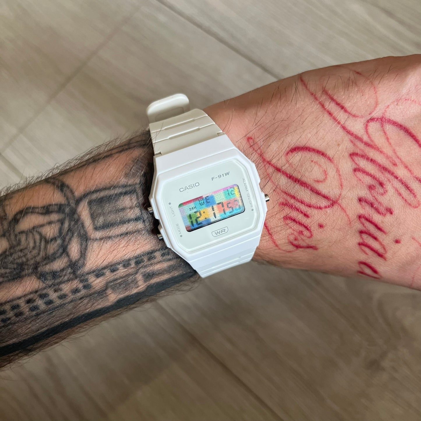 Custom Casio F-91W White digital watch featuring a Multicolor interlocking bricks filter screen. Slim 8.5 mm profile, lightweight 21 g build and flexible bio-based resin band ensure lasting comfort. Includes alarm, stopwatch, and microlight function for everyday functionality.