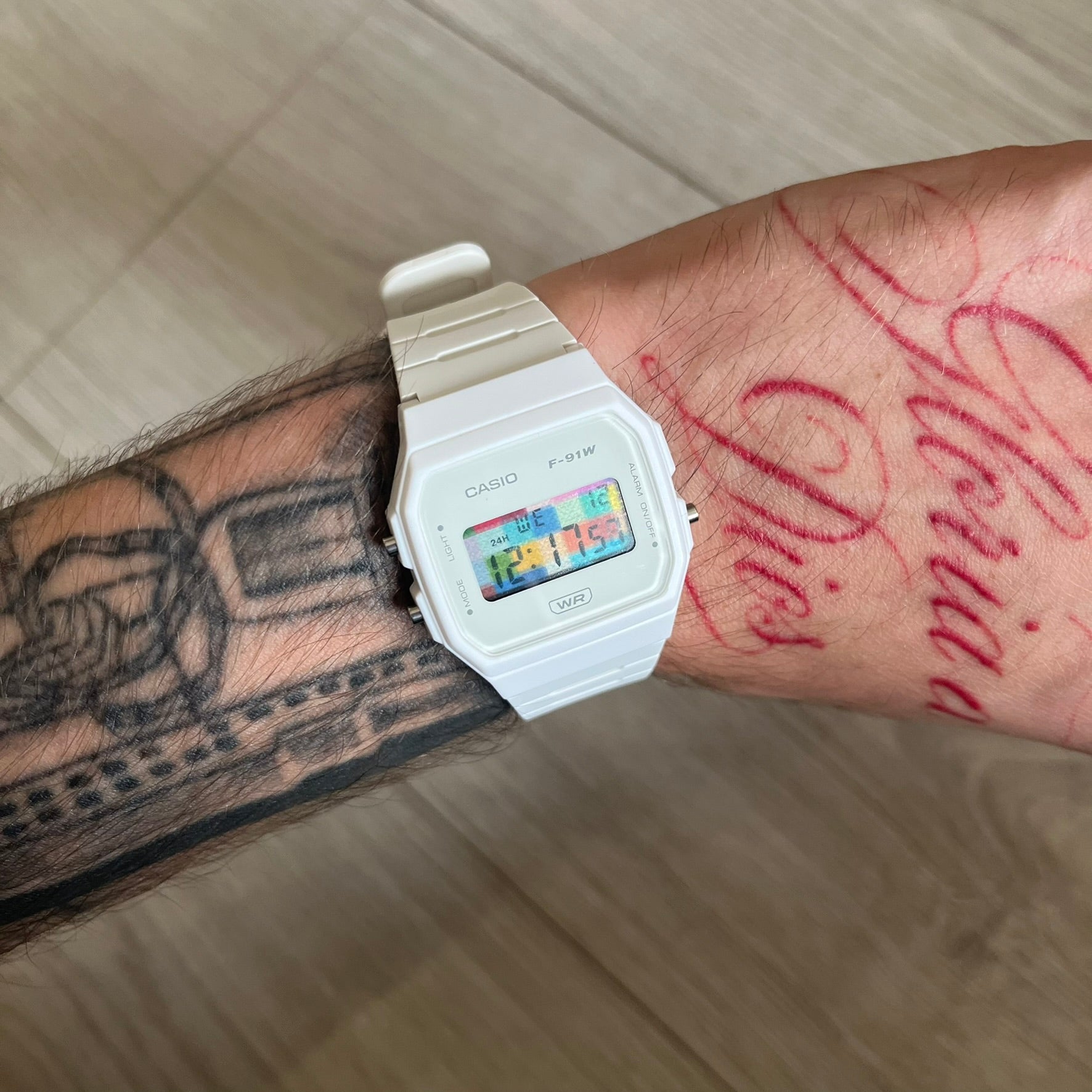 Custom Casio F-91W White digital watch featuring a Multicolor interlocking bricks filter screen. Slim 8.5 mm profile, lightweight 21 g build and flexible bio-based resin band ensure lasting comfort. Includes alarm, stopwatch, and microlight function for everyday functionality.