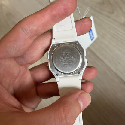 Custom Casio F-91W White digital watch featuring a Multicolor interlocking bricks filter screen. Slim 8.5 mm profile, lightweight 21 g build and flexible bio-based resin band ensure lasting comfort. Includes alarm, stopwatch, and microlight function for everyday functionality.