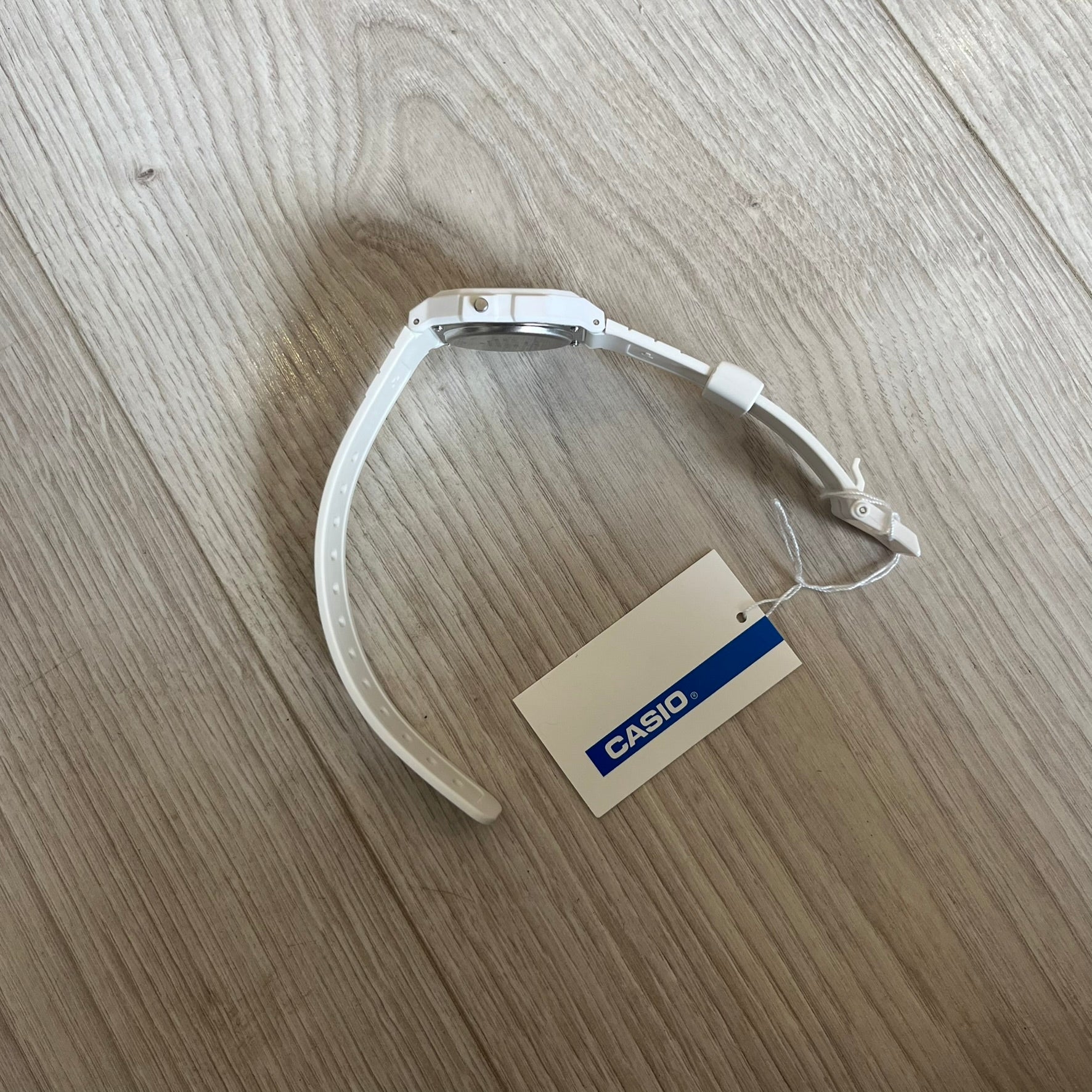 Custom Casio F-91W White digital watch featuring a Multicolor interlocking bricks filter screen. Slim 8.5 mm profile, lightweight 21 g build and flexible bio-based resin band ensure lasting comfort. Includes alarm, stopwatch, and microlight function for everyday functionality.