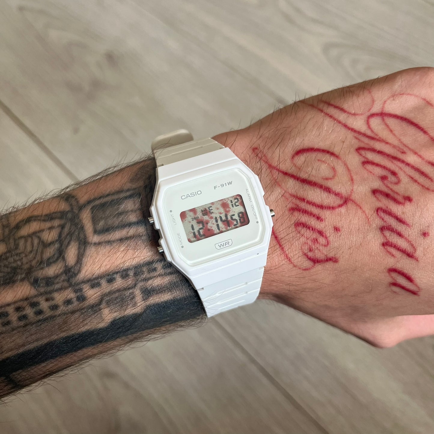 Custom Casio F-91W White digital watch featuring a Bloody filter screen. Slim 8.5 mm profile, lightweight 21 g build and flexible bio-based resin band ensure lasting comfort. Includes alarm, stopwatch, and microlight function for everyday functionality.