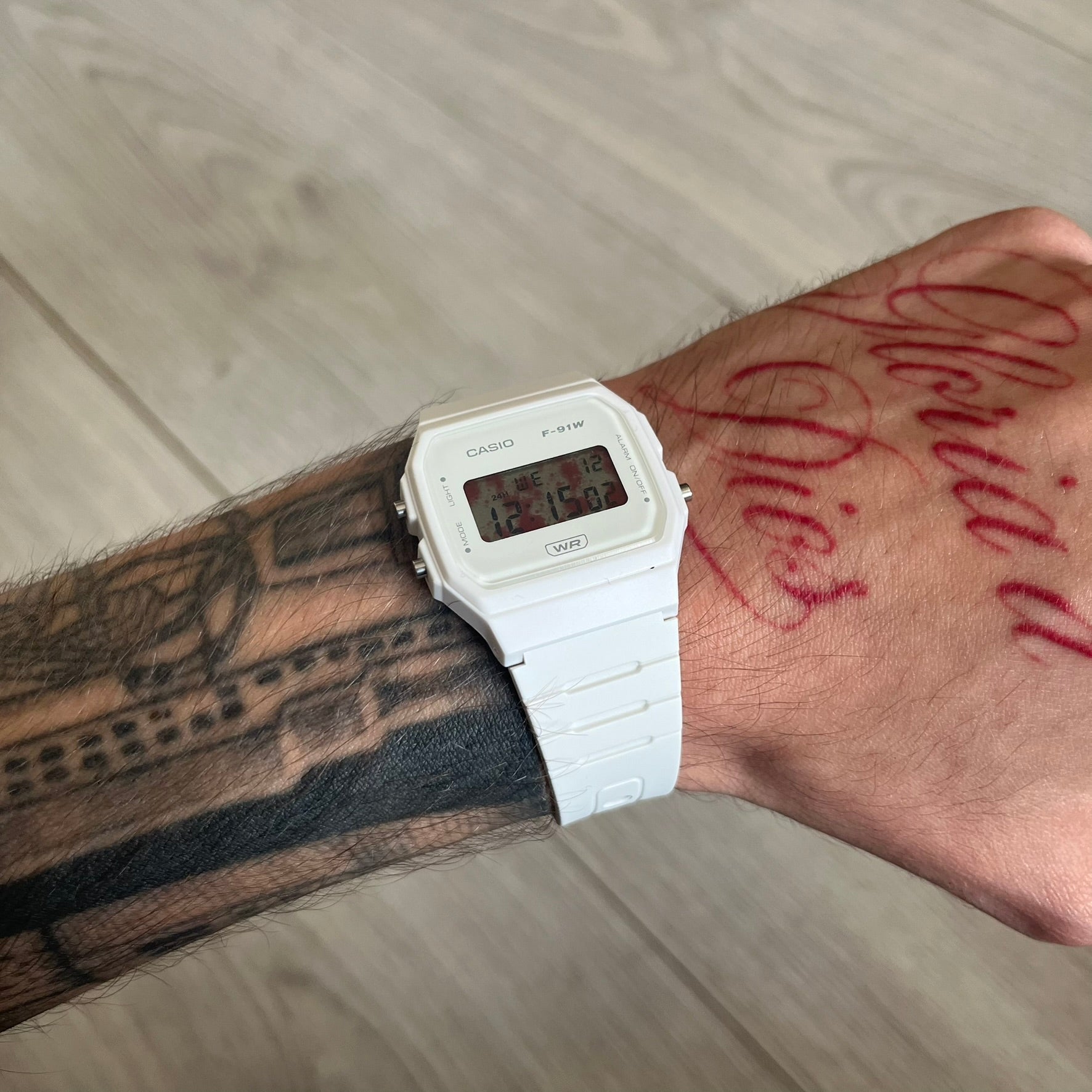 Custom Casio F-91W White digital watch featuring a Bloody filter screen. Slim 8.5 mm profile, lightweight 21 g build and flexible bio-based resin band ensure lasting comfort. Includes alarm, stopwatch, and microlight function for everyday functionality.