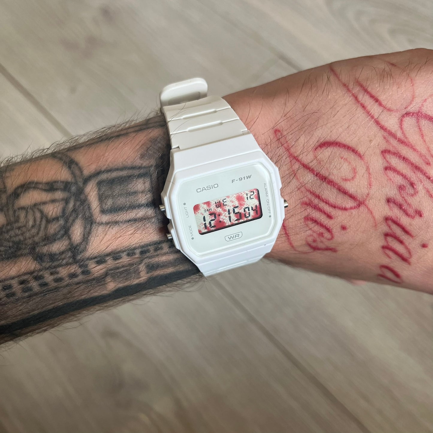 Custom Casio F-91W White digital watch featuring a Bloody filter screen. Slim 8.5 mm profile, lightweight 21 g build and flexible bio-based resin band ensure lasting comfort. Includes alarm, stopwatch, and microlight function for everyday functionality.