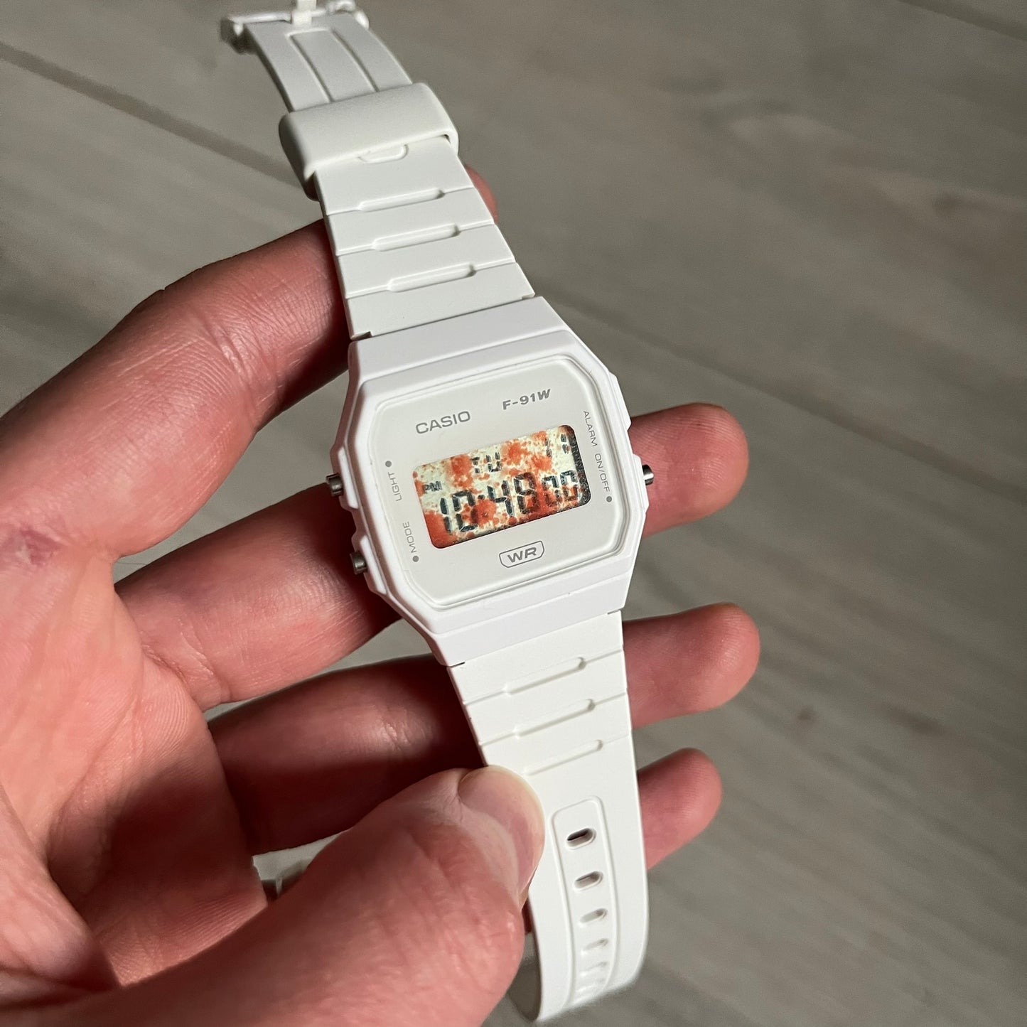 Custom Casio F-91W White digital watch featuring a Bloody filter screen. Slim 8.5 mm profile, lightweight 21 g build and flexible bio-based resin band ensure lasting comfort. Includes alarm, stopwatch, and microlight function for everyday functionality.