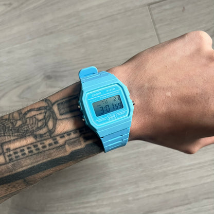 Custom Casio F-91W Baby Blue digital watch featuring a Gradient Blue filter screen. Slim 8.5 mm profile, lightweight 21 g build and flexible bio-based resin band ensure lasting comfort. Includes alarm, stopwatch, and microlight function for everyday functionality.