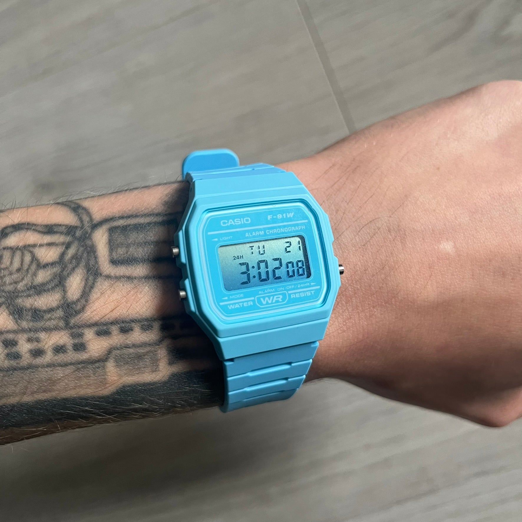 Custom Casio F-91W Baby Blue digital watch featuring a Gradient Blue filter screen. Slim 8.5 mm profile, lightweight 21 g build and flexible bio-based resin band ensure lasting comfort. Includes alarm, stopwatch, and microlight function for everyday functionality.