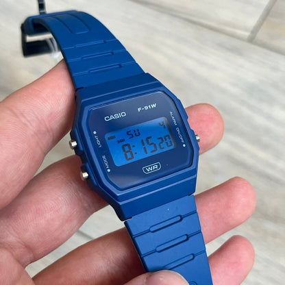 Custom Casio F-91W Dark blue digital watch featuring a matching Blue filter screen. Slim 8.5 mm profile, lightweight 21 g build and flexible resin band ensure lasting comfort. Includes alarm, stopwatch, and microlight function for everyday functionality.