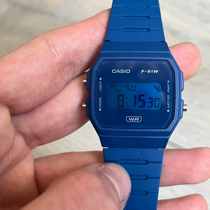 Custom Casio F-91W Dark blue digital watch featuring a matching Blue filter screen. Slim 8.5 mm profile, lightweight 21 g build and flexible resin band ensure lasting comfort. Includes alarm, stopwatch, and microlight function for everyday functionality.