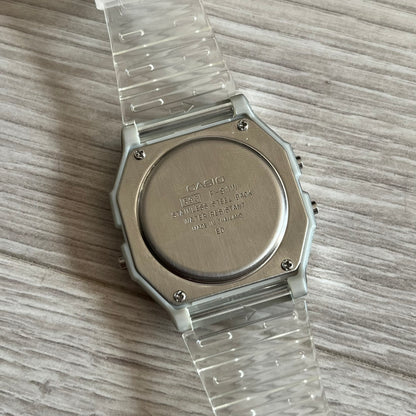 Custom Casio F-91W Clear/Transparent digital watch featuring a Brazil Flag filter screen. Slim 8.5 mm profile, lightweight 21 g build and flexible bio-based resin band ensure lasting comfort. Includes alarm, stopwatch, and microlight function for everyday functionality.
