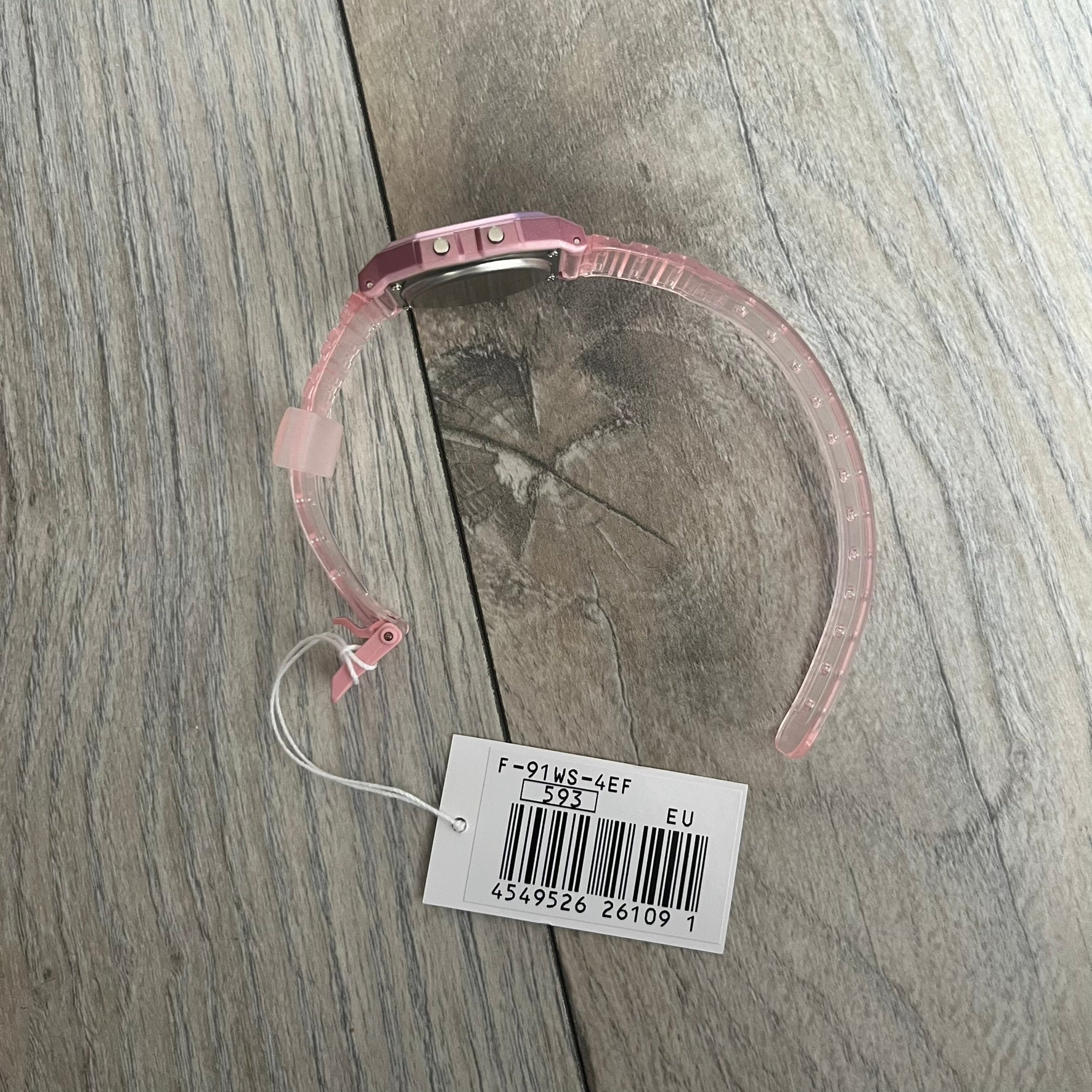 Custom Casio F-91W Pink digital watch featuring a gradient mint and pink filter screen. Slim 8.5 mm profile, lightweight 21 g build and flexible bio-based resin band ensure lasting comfort. Includes alarm, stopwatch, and microlight function for everyday functionality.