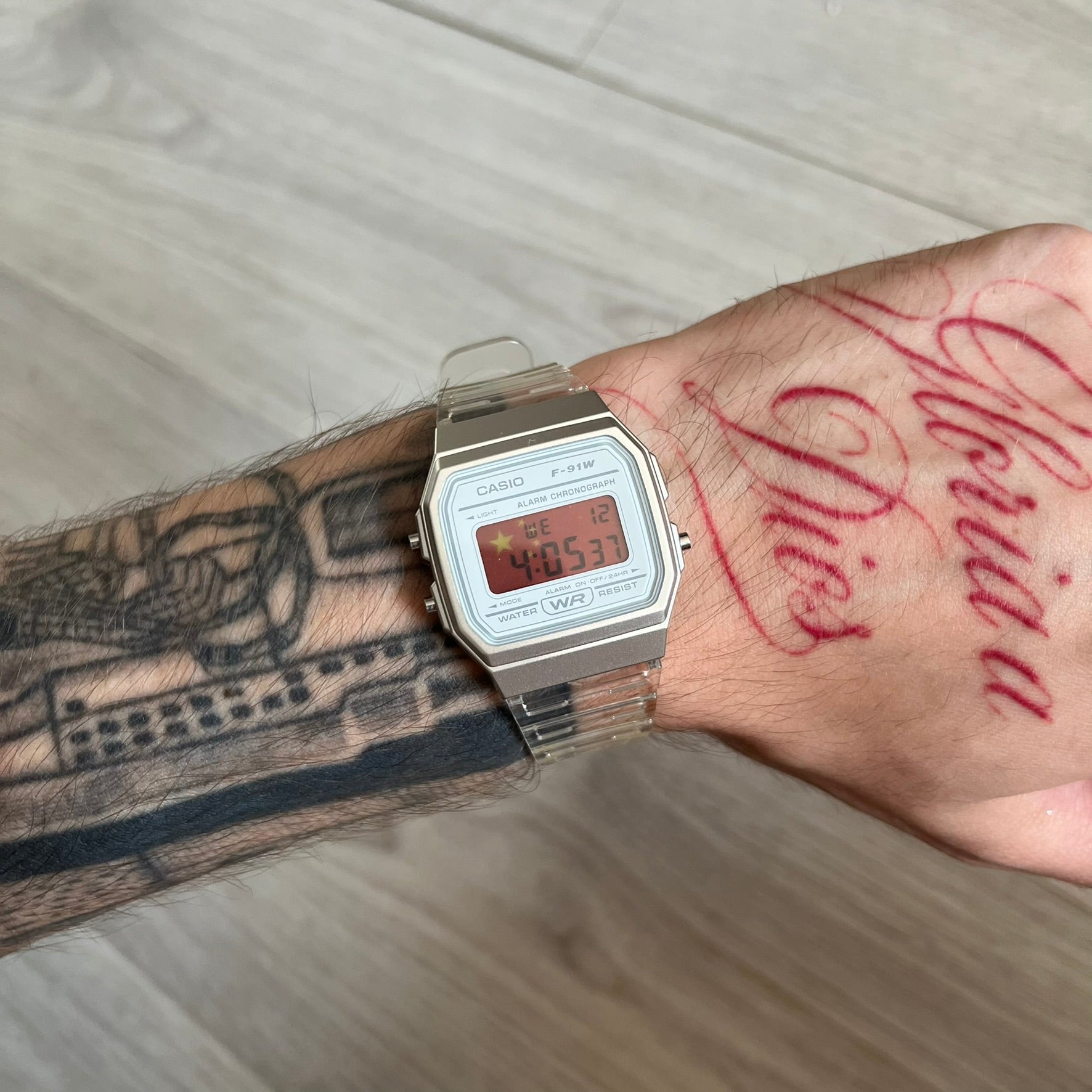 Custom Casio F-91W Clear/Transparent digital watch featuring a China Flag filter screen. Slim 8.5 mm profile, lightweight 21 g build and flexible bio-based resin band ensure lasting comfort. Includes alarm, stopwatch, and microlight function for everyday functionality.
