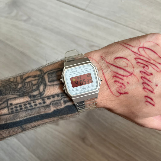 Custom Casio F-91W Clear/Transparent digital watch featuring a China Flag filter screen. Slim 8.5 mm profile, lightweight 21 g build and flexible bio-based resin band ensure lasting comfort. Includes alarm, stopwatch, and microlight function for everyday functionality.
