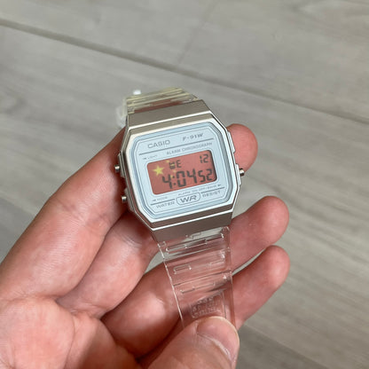 Custom Casio F-91W Clear/Transparent digital watch featuring a China Flag filter screen. Slim 8.5 mm profile, lightweight 21 g build and flexible bio-based resin band ensure lasting comfort. Includes alarm, stopwatch, and microlight function for everyday functionality.