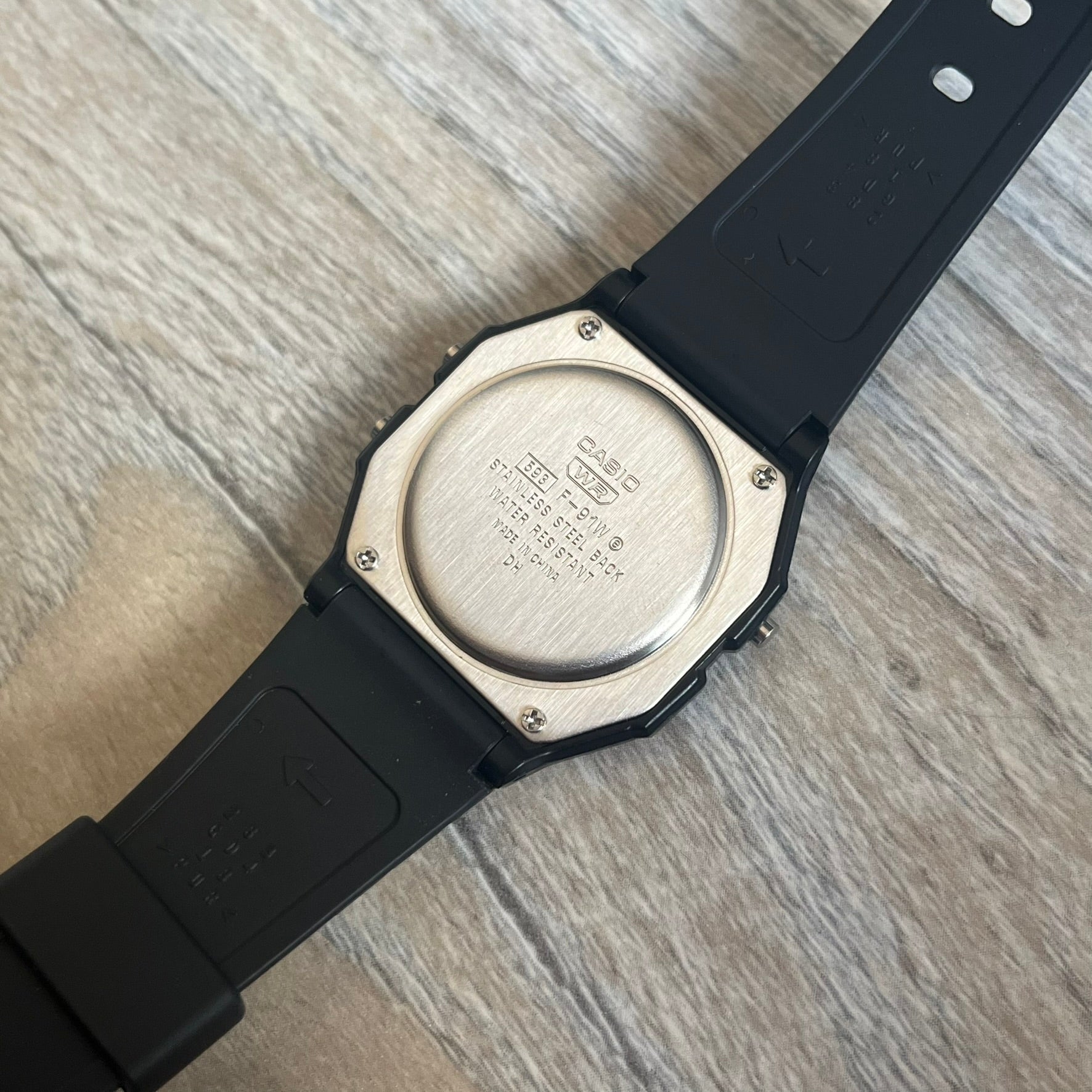 Custom Casio F-91W Black digital watch featuring a Anime red eyes filter screen. Slim 8.5 mm profile, lightweight 21 g build and flexible bio-based resin band ensure lasting comfort. Includes alarm, stopwatch, and microlight function for everyday functionality.
