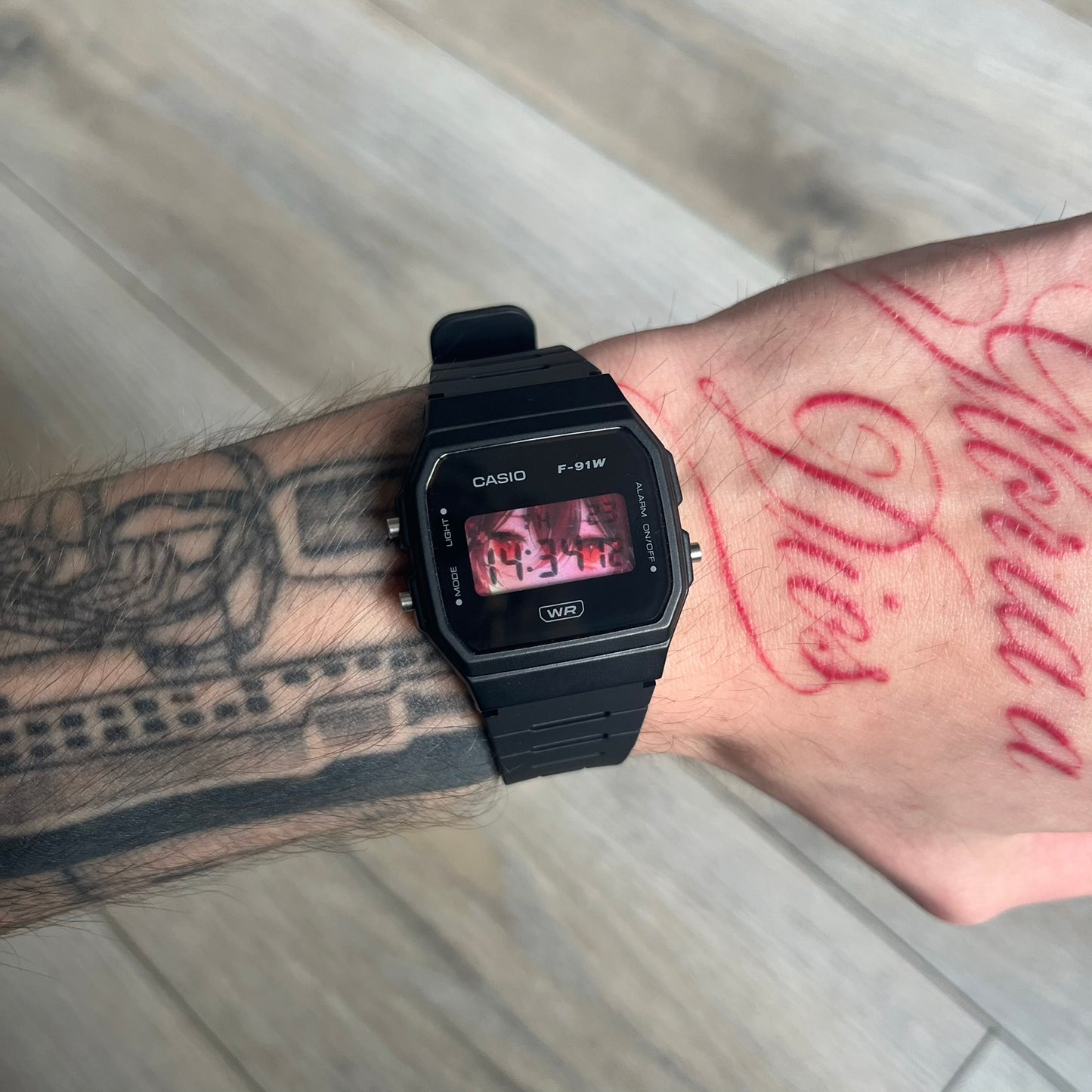 Custom Casio F-91W Black digital watch featuring a Anime red eyes filter screen. Slim 8.5 mm profile, lightweight 21 g build and flexible bio-based resin band ensure lasting comfort. Includes alarm, stopwatch, and microlight function for everyday functionality.