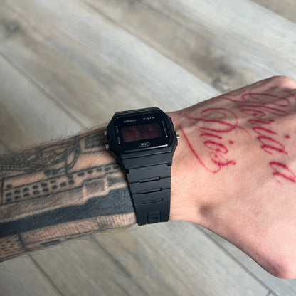 Custom Casio F-91W Black digital watch featuring a Anime red eyes filter screen. Slim 8.5 mm profile, lightweight 21 g build and flexible bio-based resin band ensure lasting comfort. Includes alarm, stopwatch, and microlight function for everyday functionality.