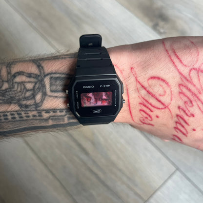 Custom Casio F-91W Black digital watch featuring a Anime red eyes filter screen. Slim 8.5 mm profile, lightweight 21 g build and flexible bio-based resin band ensure lasting comfort. Includes alarm, stopwatch, and microlight function for everyday functionality.