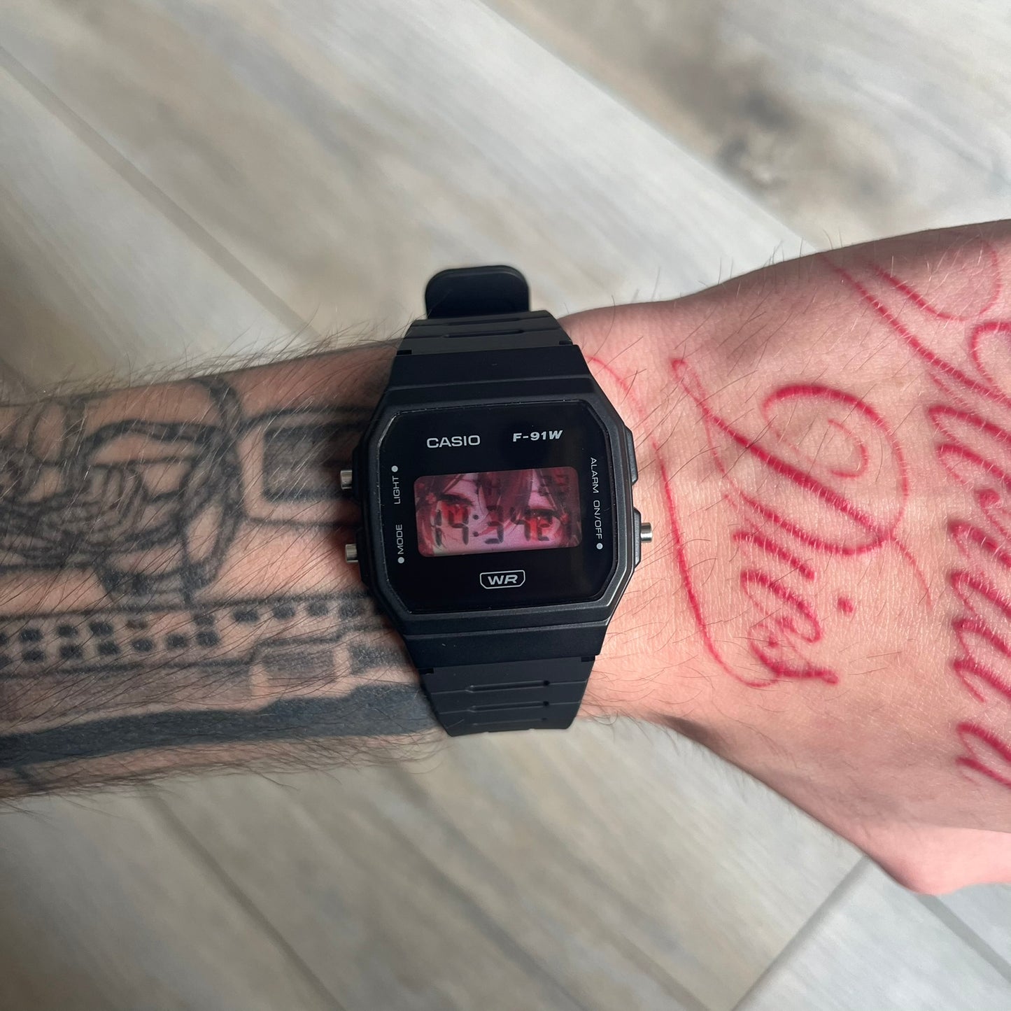 Custom Casio F-91W Black digital watch featuring a Anime red eyes filter screen. Slim 8.5 mm profile, lightweight 21 g build and flexible bio-based resin band ensure lasting comfort. Includes alarm, stopwatch, and microlight function for everyday functionality.