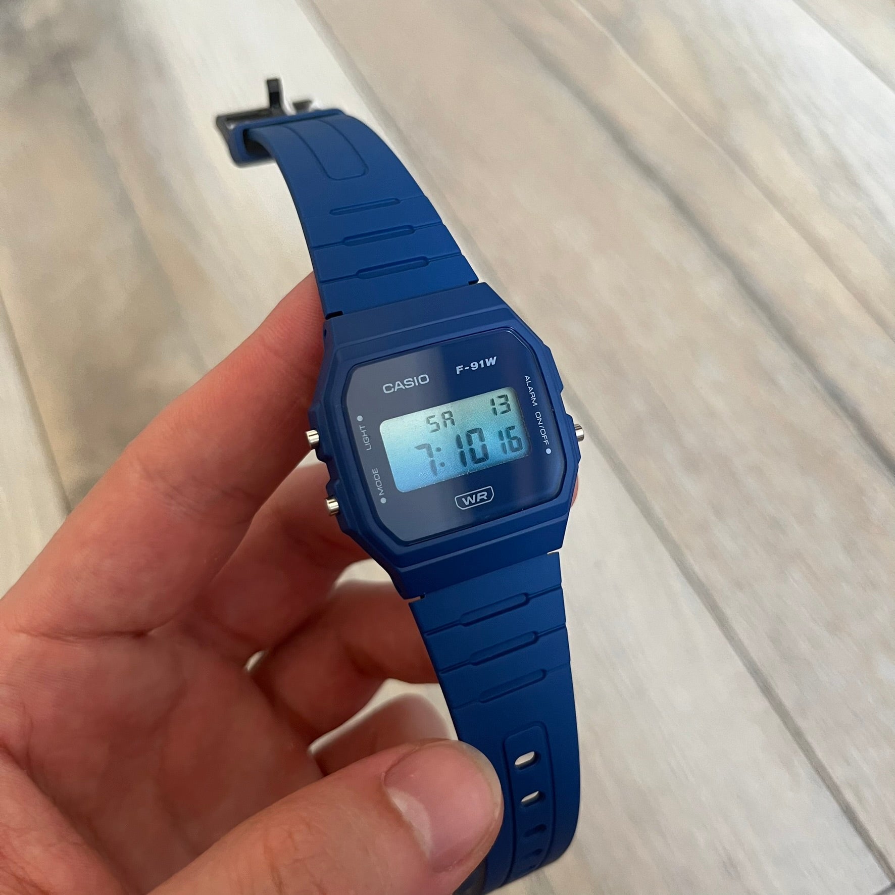 Custom Casio F-91W Dark blue digital watch featuring a Gradient blue filter screen. Slim 8.5 mm profile, lightweight 21 g build and flexible resin band ensure lasting comfort. Includes alarm, stopwatch, and microlight function for everyday functionality.