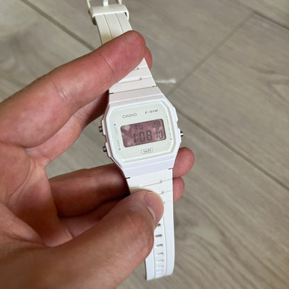 Custom Casio F-91W White digital watch featuring a Purple drink filter screen. Slim 8.5 mm profile, lightweight 21 g build and flexible bio-based resin band ensure lasting comfort. Includes alarm, stopwatch, and microlight function for everyday functionality.