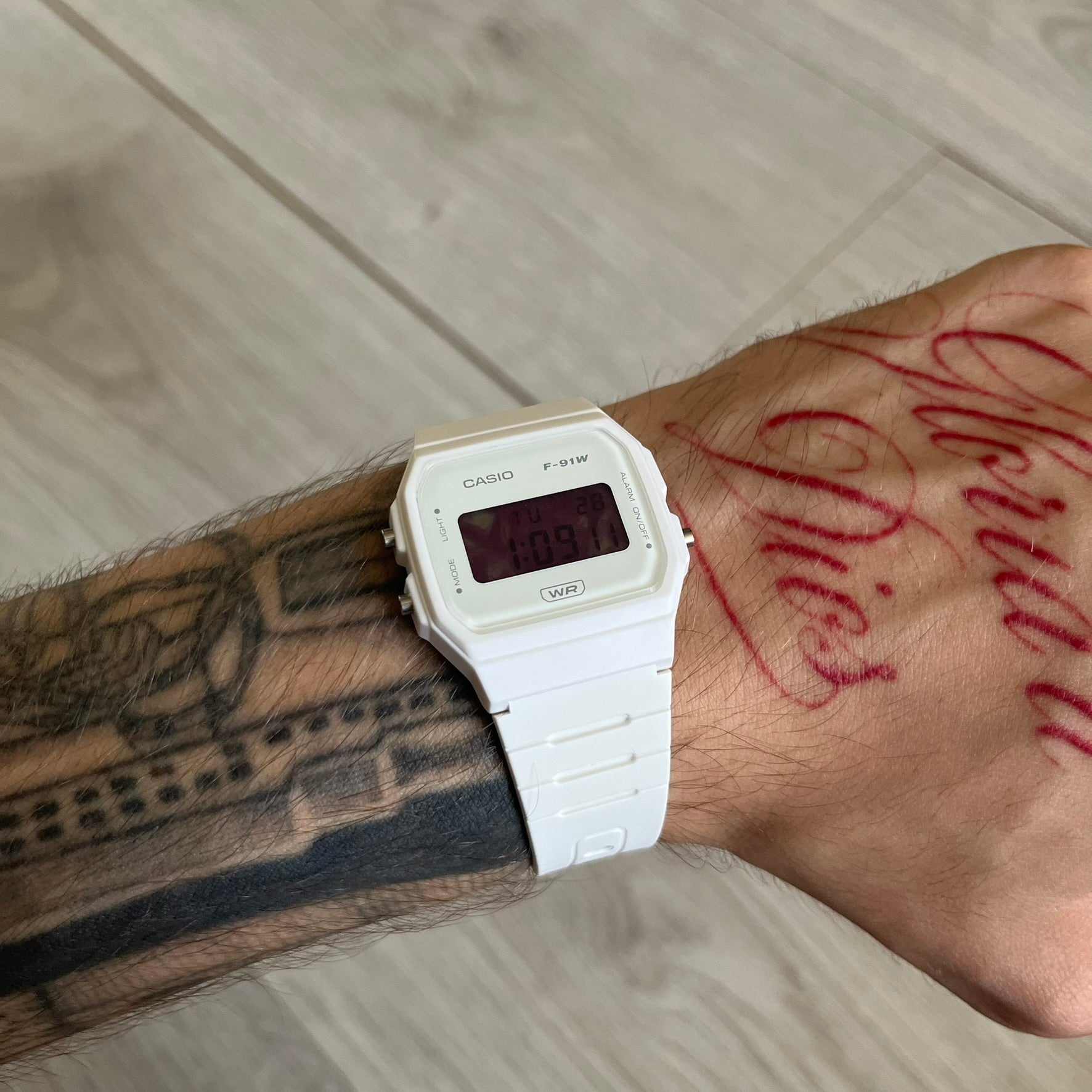 Custom Casio F-91W White digital watch featuring a Purple drink filter screen. Slim 8.5 mm profile, lightweight 21 g build and flexible bio-based resin band ensure lasting comfort. Includes alarm, stopwatch, and microlight function for everyday functionality.