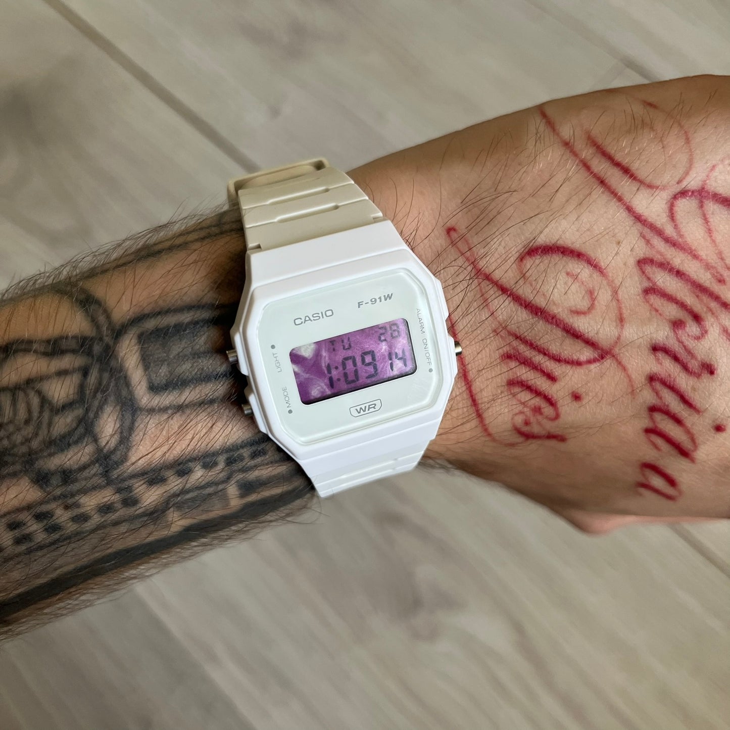 Custom Casio F-91W White digital watch featuring a Purple drink filter screen. Slim 8.5 mm profile, lightweight 21 g build and flexible bio-based resin band ensure lasting comfort. Includes alarm, stopwatch, and microlight function for everyday functionality.