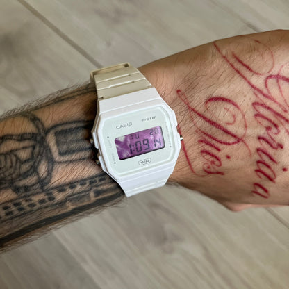 Custom Casio F-91W White digital watch featuring a Purple drink filter screen. Slim 8.5 mm profile, lightweight 21 g build and flexible bio-based resin band ensure lasting comfort. Includes alarm, stopwatch, and microlight function for everyday functionality.