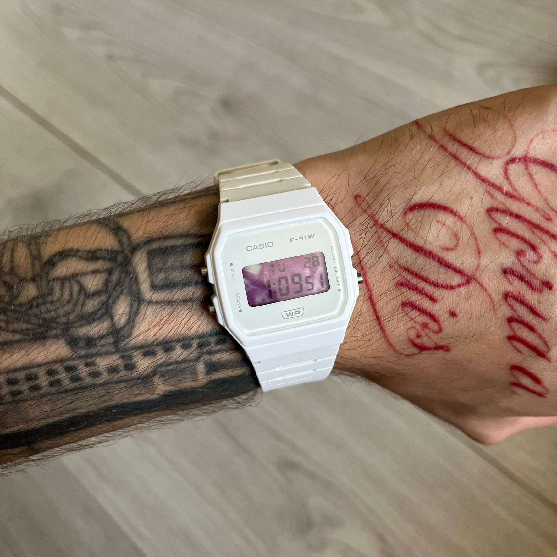 Custom Casio F-91W White digital watch featuring a Purple drink filter screen. Slim 8.5 mm profile, lightweight 21 g build and flexible bio-based resin band ensure lasting comfort. Includes alarm, stopwatch, and microlight function for everyday functionality.